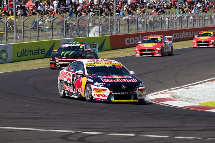 Fast Moving Racing Cars On The Track