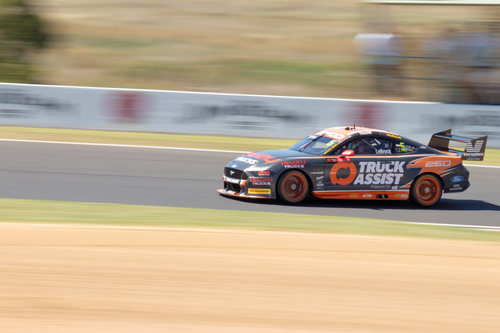 Free A racing car speeds around Mount Panorama track, showcasing dynamic motion and precision. Stock Photo