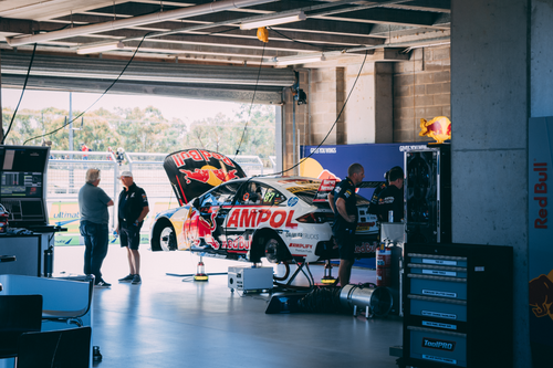 Free Mechanics work on a racing car in a garage at Mount Panorama, Australia. Stock Photo