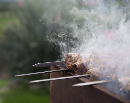 Charcoal Grill Cooking of Skewered Meat