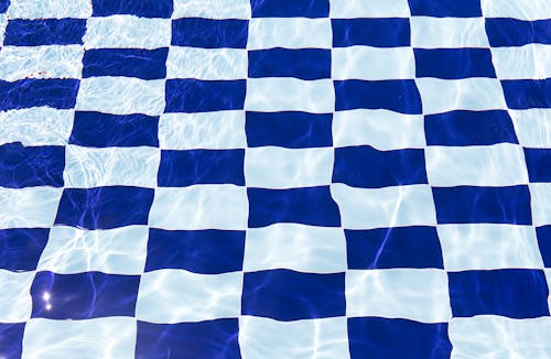 White and Blue Checkered Design of the Pool Tiles