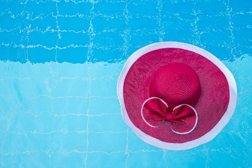 A Pink Hat Floating on the Swimming Pool