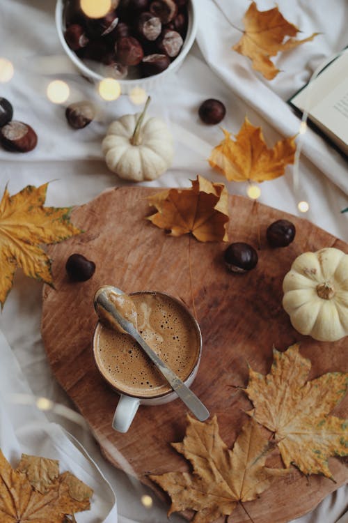 Coffee on Table with Autumn Decoration