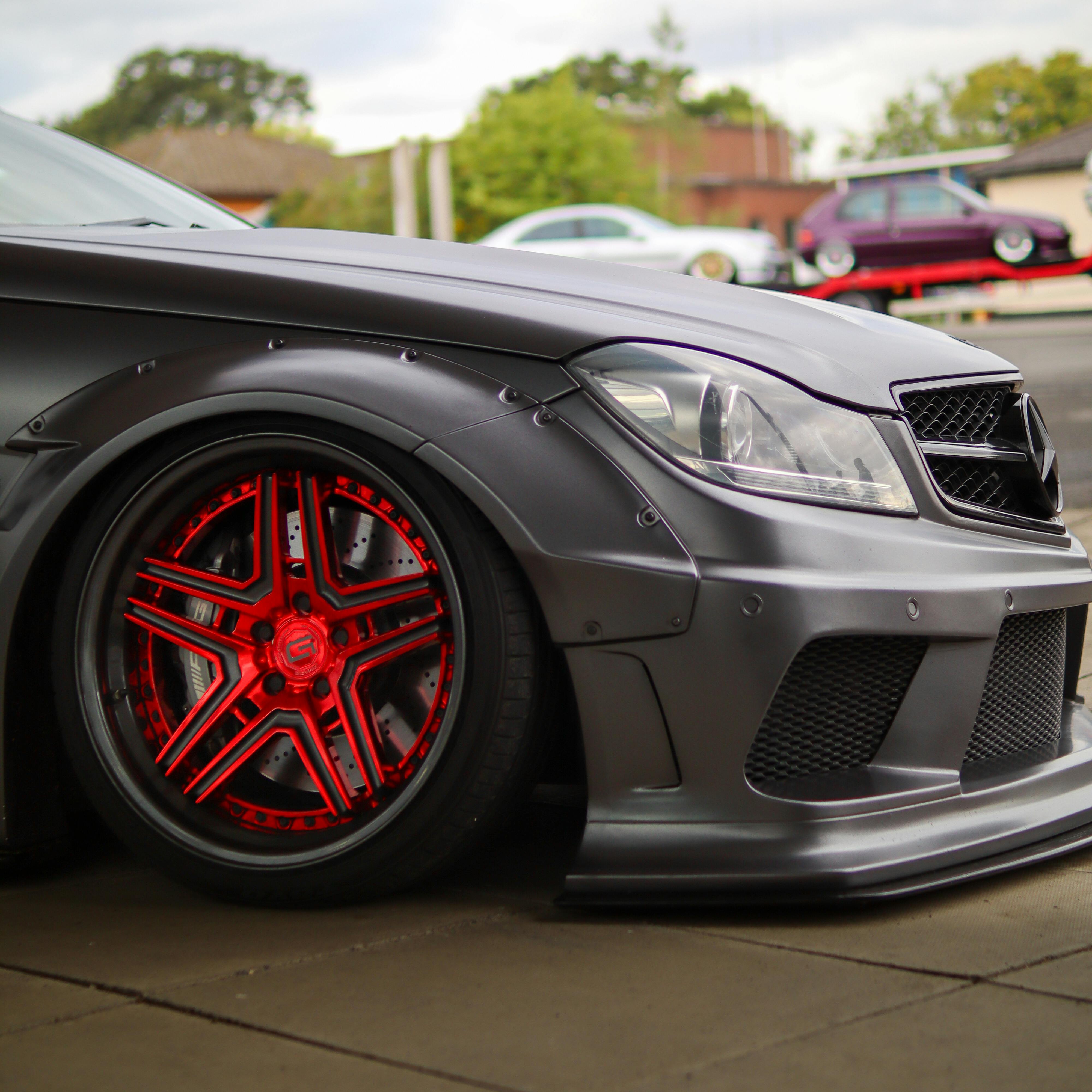 Gray Car Parked on Concrete Pavement