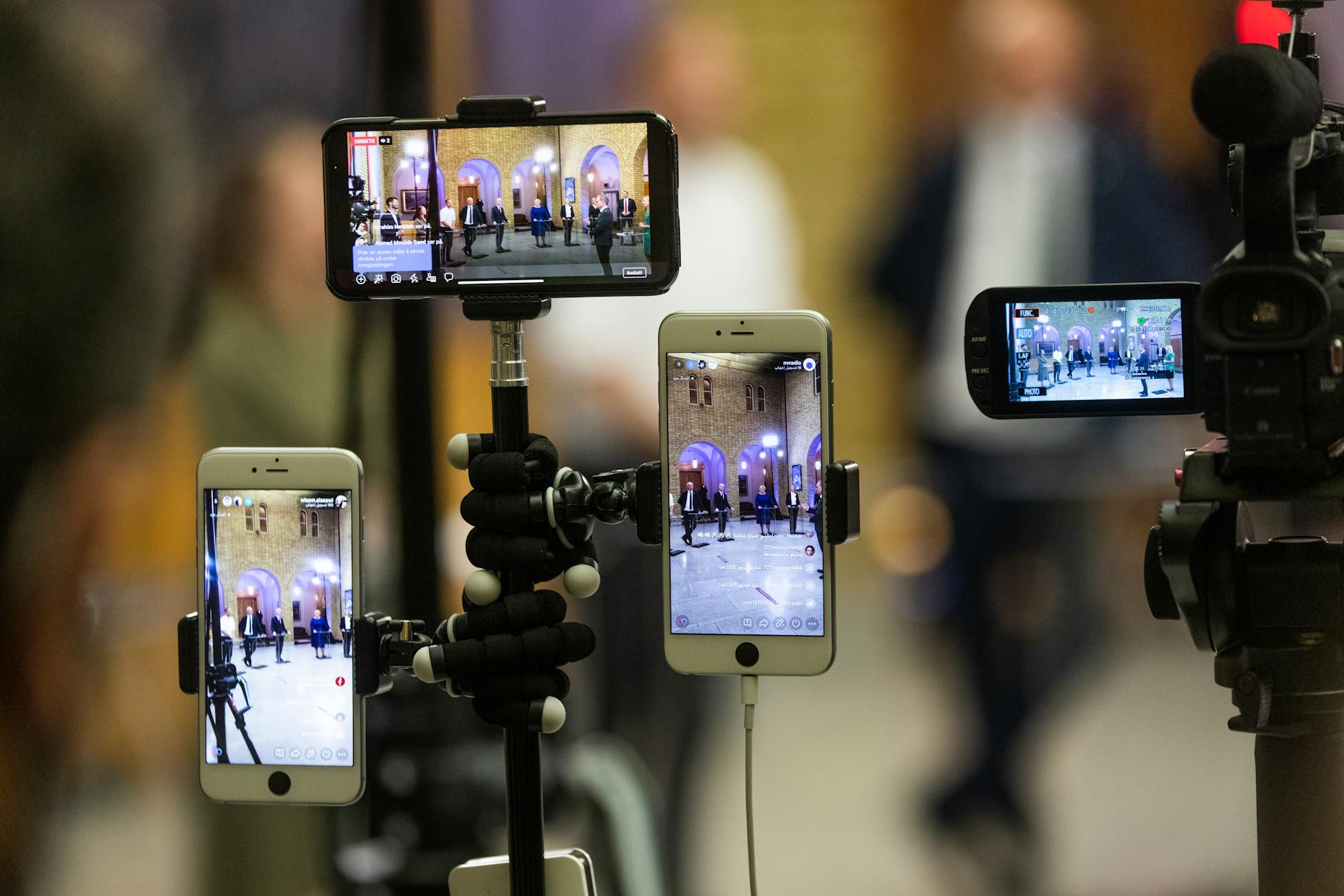 https://www.pexels.com/photo/smartphones-hanging-on-the-tripod-9622792/