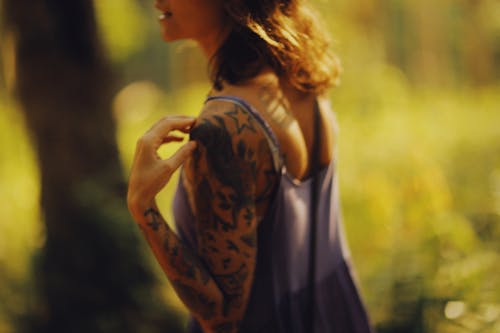 A Woman with a Tattoo on her Arm