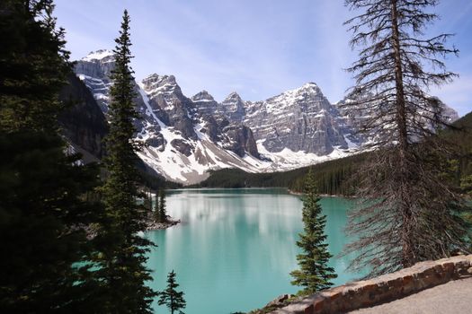 Stunning view of Moraine Lake with snow-capped mountains in Banff National Park, perfect for travel photography.