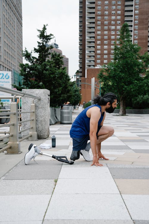 Man with Prosthetic Leg doing Stretching Exercises