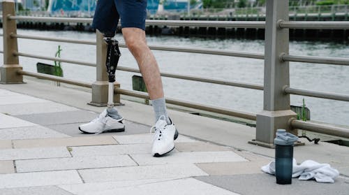 Free Person with Prosthetic Leg exercising  Stock Photo