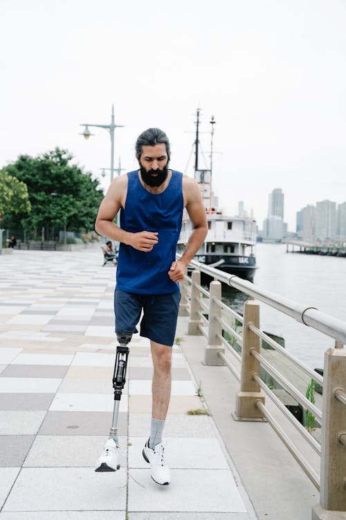 Man with Prosthetic Leg wearing Blue Tank Top 