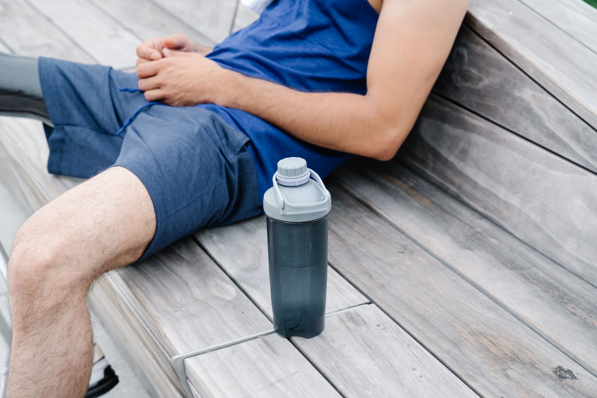 Person seated beside Tumbler