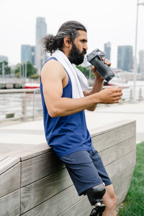 Free Man drinking Water after workout  Stock Photo