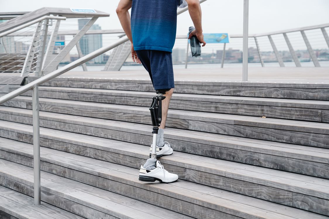 Leg Walk Man with Prosthetic Leg walking up the Stairs · Free Stock Photo
