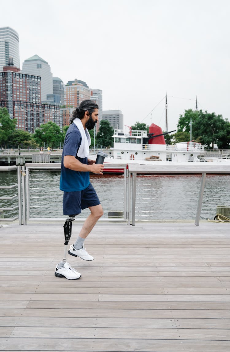 Man Jogging With A Prosthetic Leg