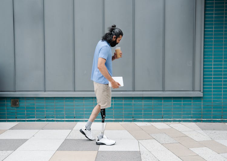 Man Walking With A Prosthetic Leg 