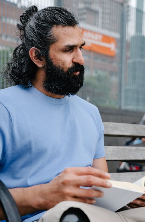 Close-up Photo of Man wearing Light Blue Crew Neck Shirt 