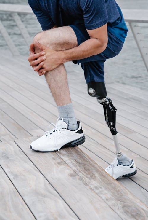 Man with Prosthetic Leg doing Stretches