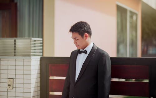 Photo of the Groom Wearing His Tuxedo