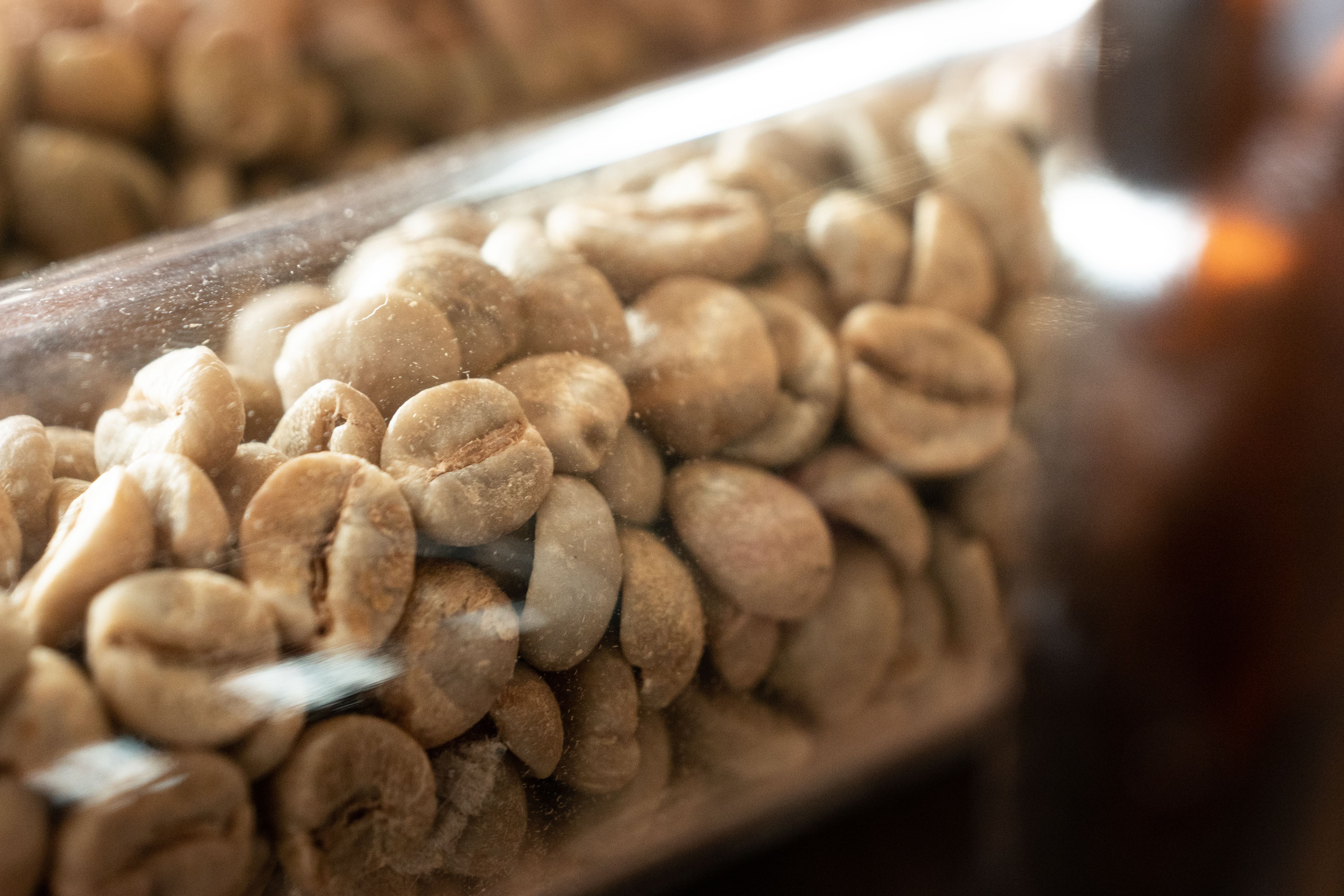 Coffee beans in a roasting tray, representing the category hit hardest by 2025-2026 import tariffs