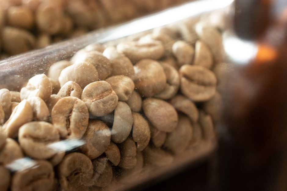 Coffee beans in a roasting tray, representing the category hit hardest by 2025-2026 import tariffs