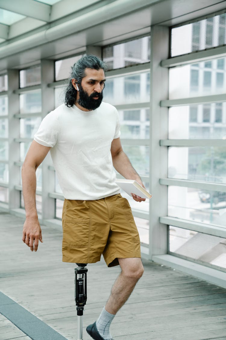 Man Walking With A Prosthetic Leg 