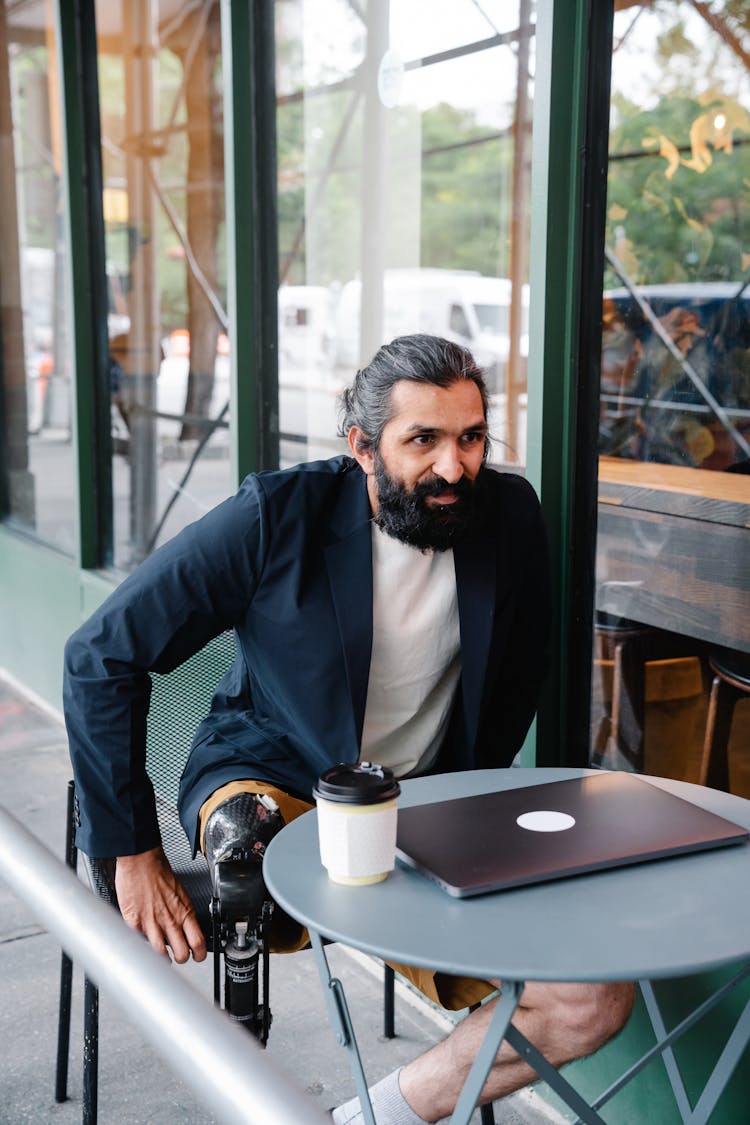 Man Standing Up From His Chair 