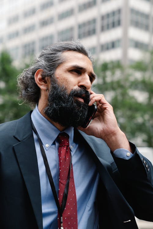 Man in Business Attire talking on Phone 