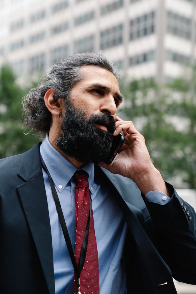 Investor taking a call outdoors — photo by Lara Jameson on Pexels