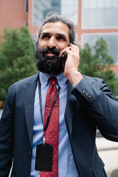 Man in Business Attire talking on Phone 