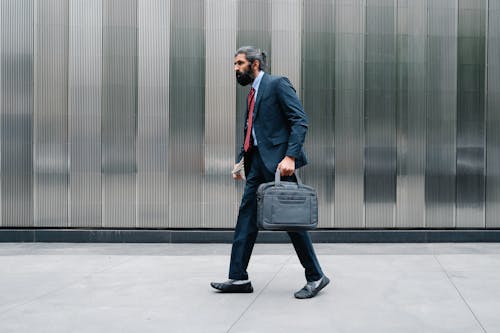 Man walkin in Full Business Attire