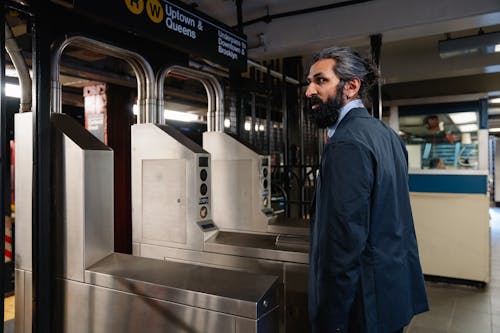 Man entering Gates of Subway Train