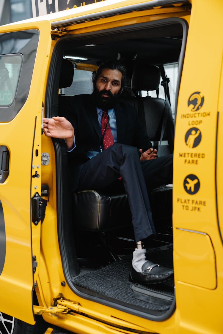 Businessman Closing The Door Of The Taxi 