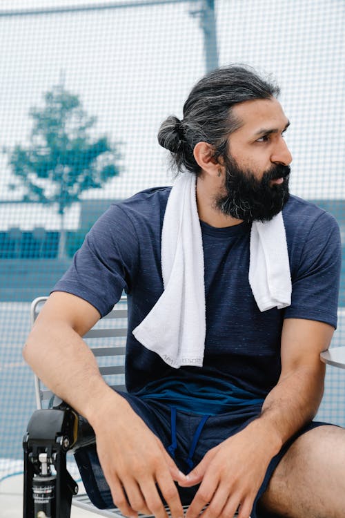 Man with Prosthetic Leg sitting on Chair