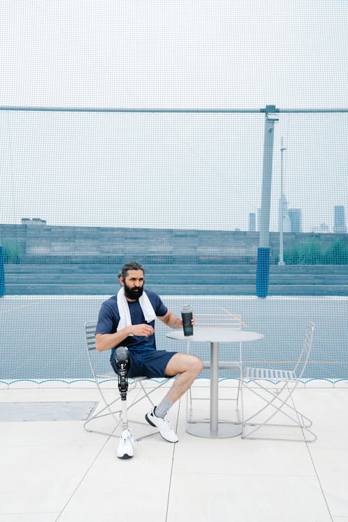 Man with Prosthetic Leg Resting after Exercise