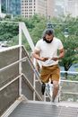 Man walking on Staircase while reading Book
