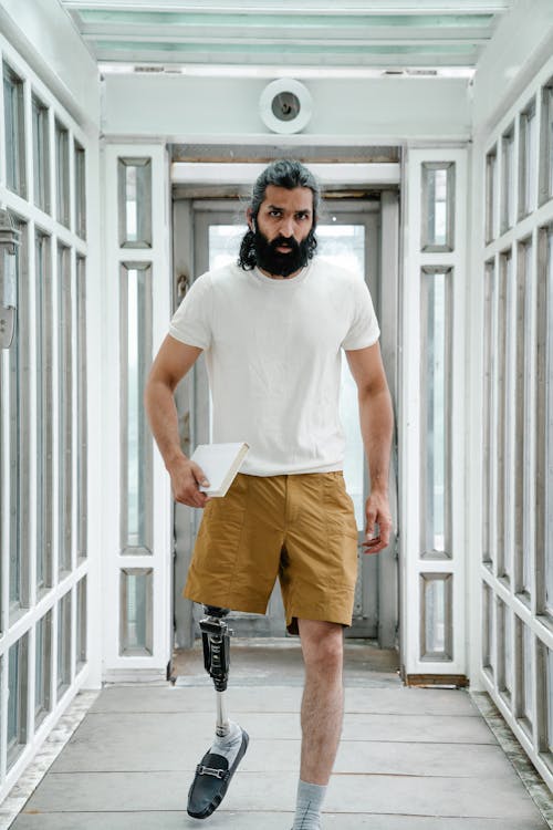 Man with Prosthetic Limb wearing White T-shirt 