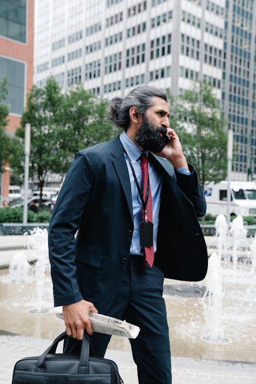 Man in Formal Business Attire talking on Phone 