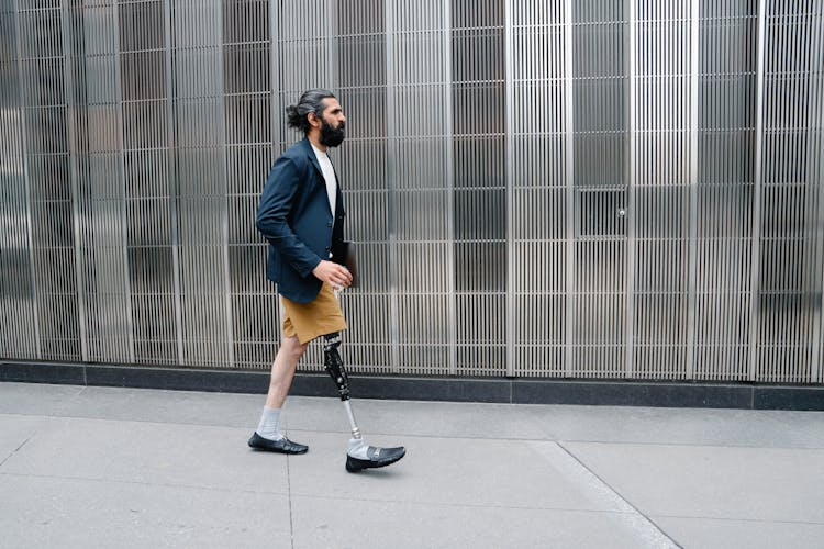 Man Walking In Prosthetic Limb