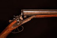 Brown and Black Rifle on Black Textile