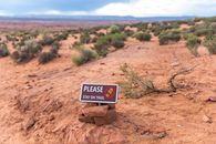 White and Brown Signage on Ground
