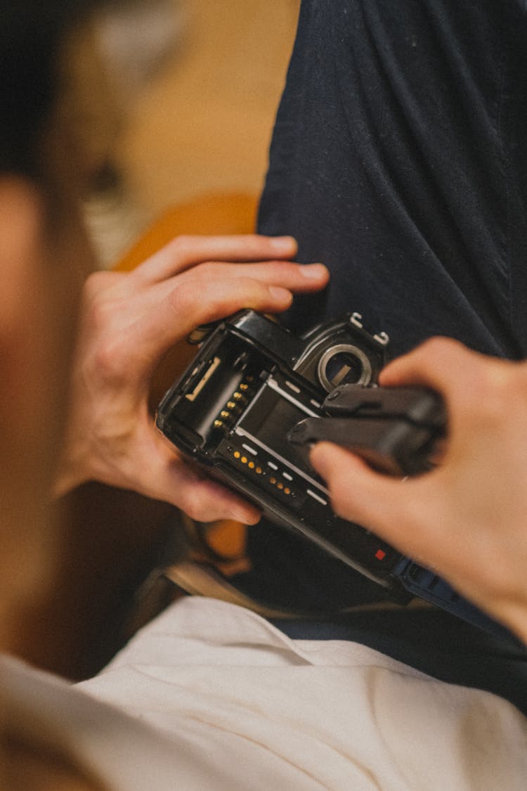 Person Holding Black Camera