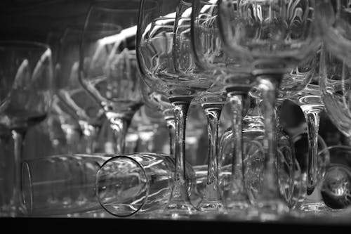 Grayscale Photo of Crystal Wine Glasses