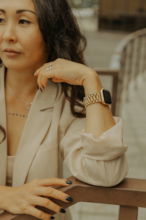 Woman Leaning on Handrail