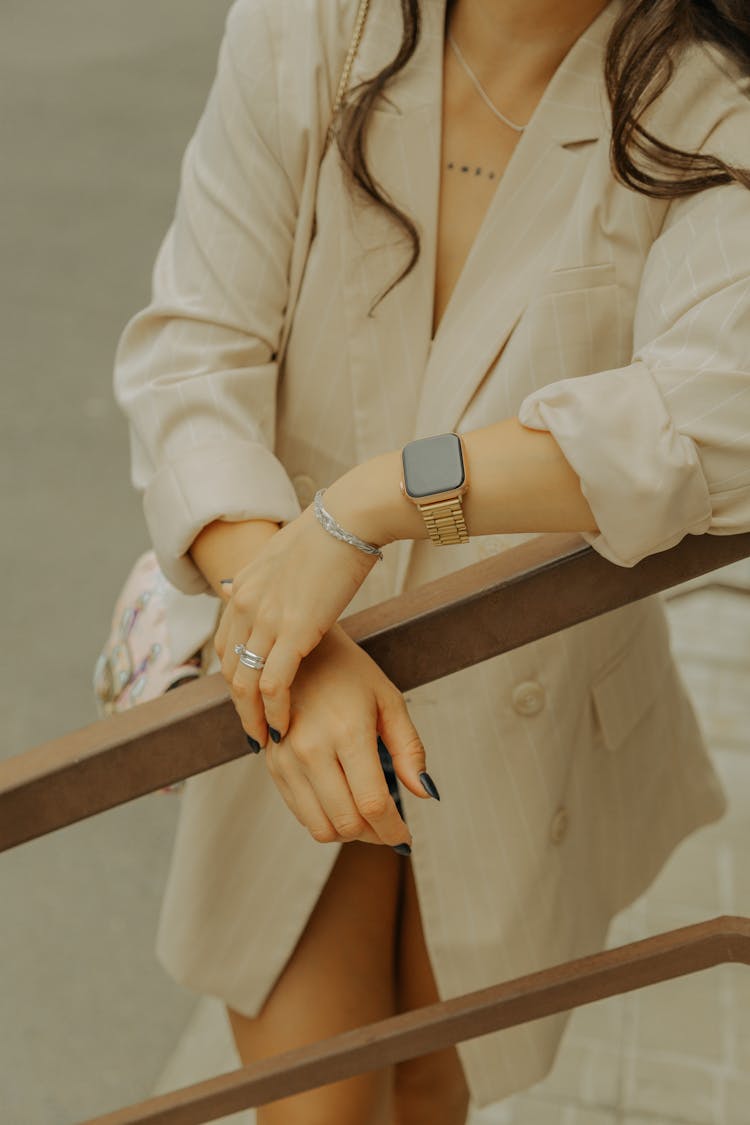 Woman Wearing Wristwatch Holding On Handrail