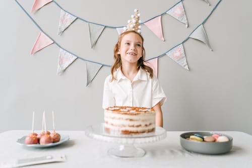Free A Young Girl Wearing Party Hat Stock Photo