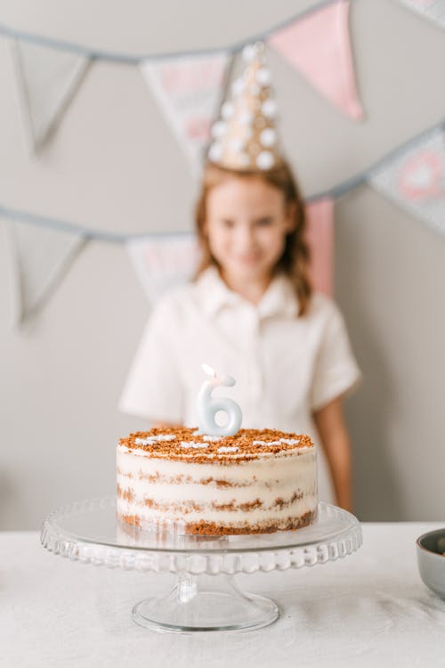 Brown and White Cake with Candle on Top