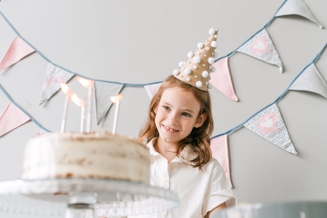 Girl Wearing Party Hat Smiling · Free Stock Photo