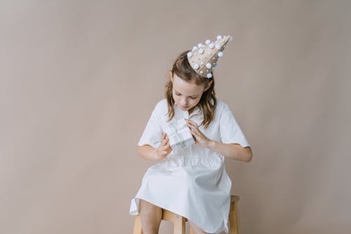 A Girl Holding a Present 