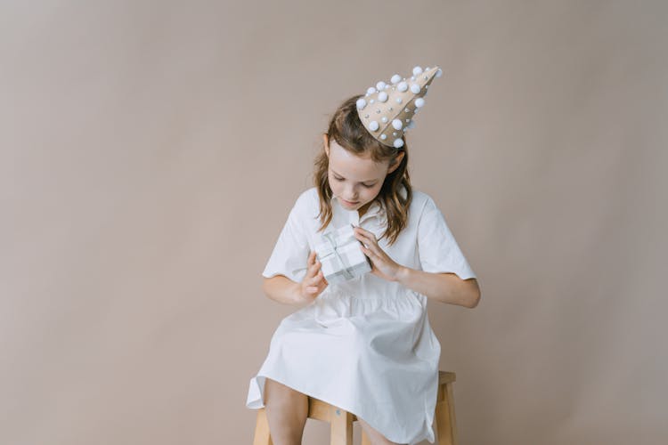 A Girl Holding A Present 