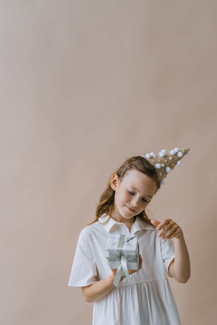 A Girl Holding A Gift 